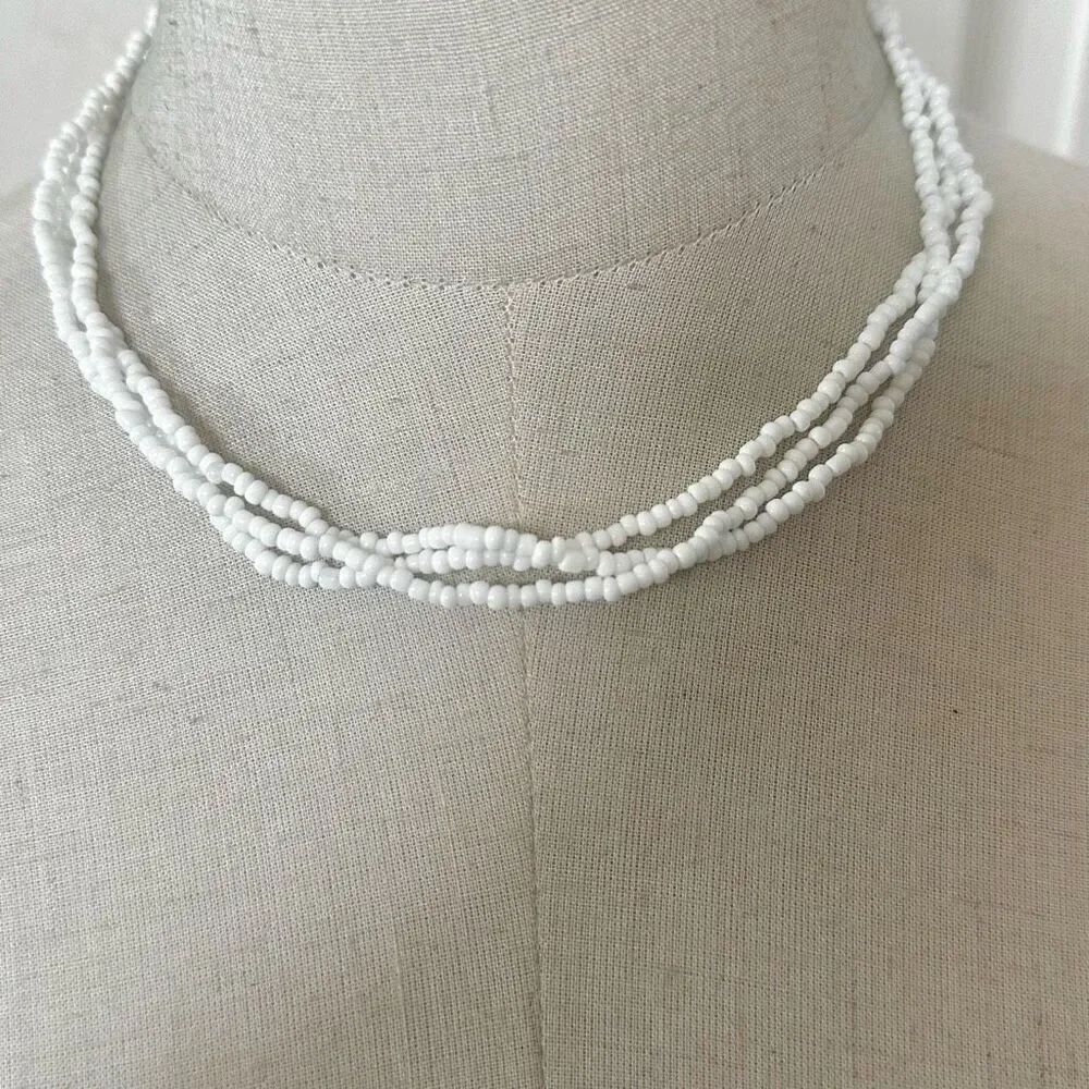 White beaded multi strand necklace